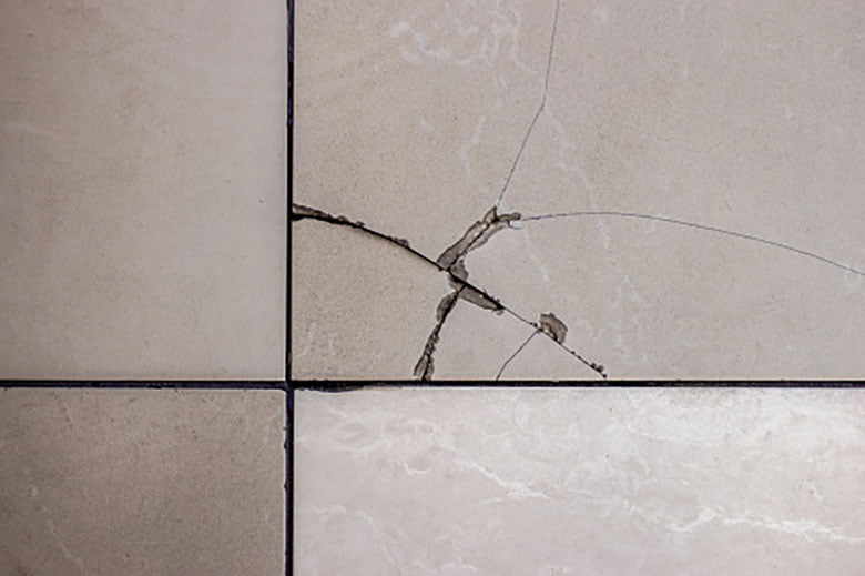 tiles popping up solution: tiles with cracks